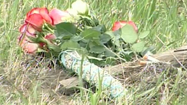 Flowers are laid at site of crash on Highway 3