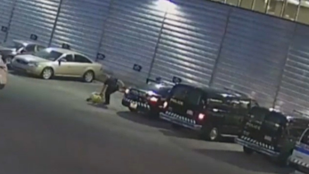 Surveillance footage of Const. Trevor Lindsay allegedly assaulting a suspect in May 2015 (court image)