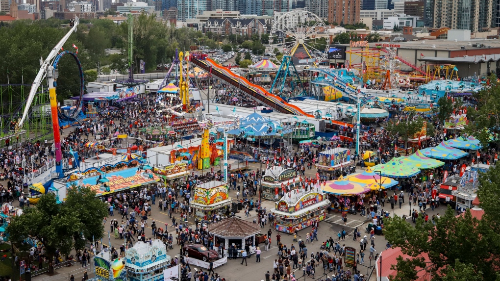 Crowds flock to the midway at the Calgary Stampede in Calgary, Sunday, July 7, 2019. THE CANADIAN PRESS/Jeff McIntosh