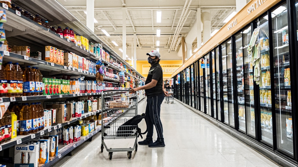 People wearing masks shop at a grocery store in Moncton, N.B., on Wednesday, September, 22, 2021. (THE CANADIAN PRESS/Christopher Katsarov) 