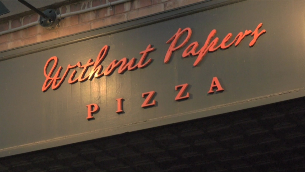 The sign for Calgary's Without Papers Pizza. 