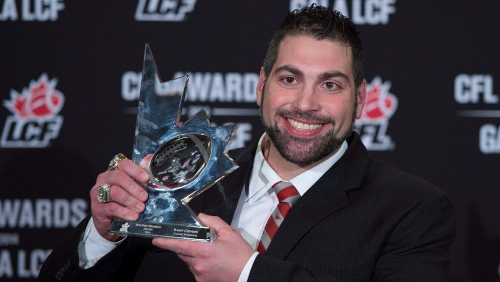 Randy Chevrier of the Calgary Stampeders celebrates his Tom Pate Memorial award during the CFL Awards in Vancouver, B.C. Thursday, Nov. 27, 2014. (THE CANADIAN PRESS/Jonathan Hayward)