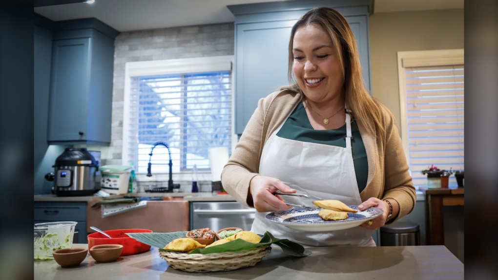 Ana Maria Moreno, who runs Valluno's Colombian Street Food and More from her home, makes empanadas in Calgary, Alta., on Dec. 1, 2021.(THE CANADIAN PRESS/Jeff McIntosh)