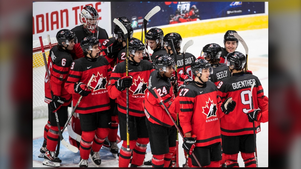 Canada celebrates the win over Russia at the end of IIHF World Junior Hockey Championship exhibition action in Edmonton, Thursday, Dec. 23, 2021. (THE CANADIAN PRESS/Jason Franson)