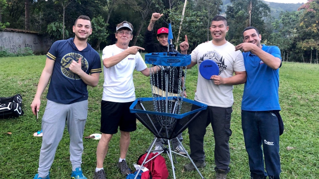 James Koizumi, second from right, celebrates after hitting the first-ever verified ace, or hole-in-one, at a course in Colombia, along with Ken Loukinen, second from left. (Courtesy James Koizumi)