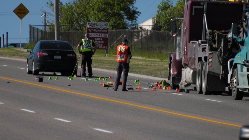 CPS members at the scene of Wednesday morning's collision where a car hit a tow truck operator along 11th St. N.E.