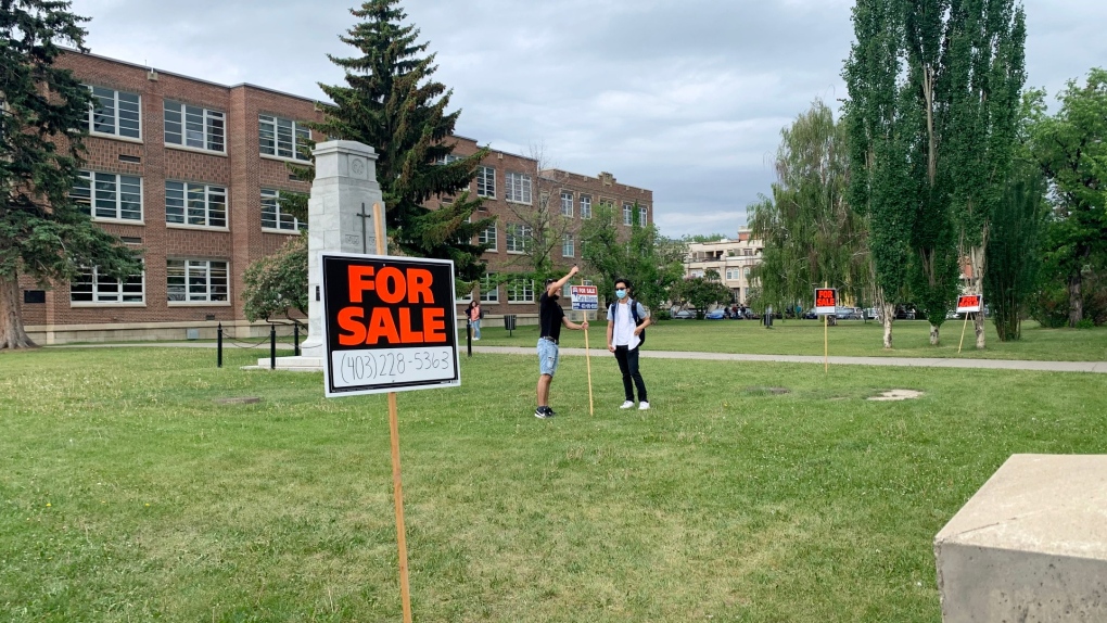 Students put 'For Sale' signs up at Western Canada High School as part of a graduation prank. (Contributed)
