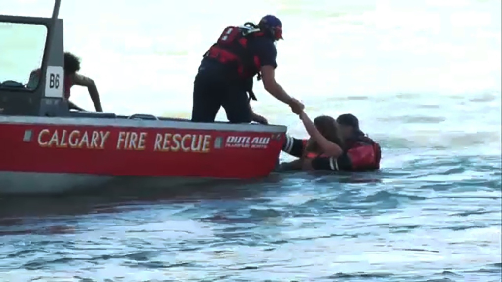 Calgary Fire Water Rescue crew pulled two people from the Bow Tuesday after their raft flipped over