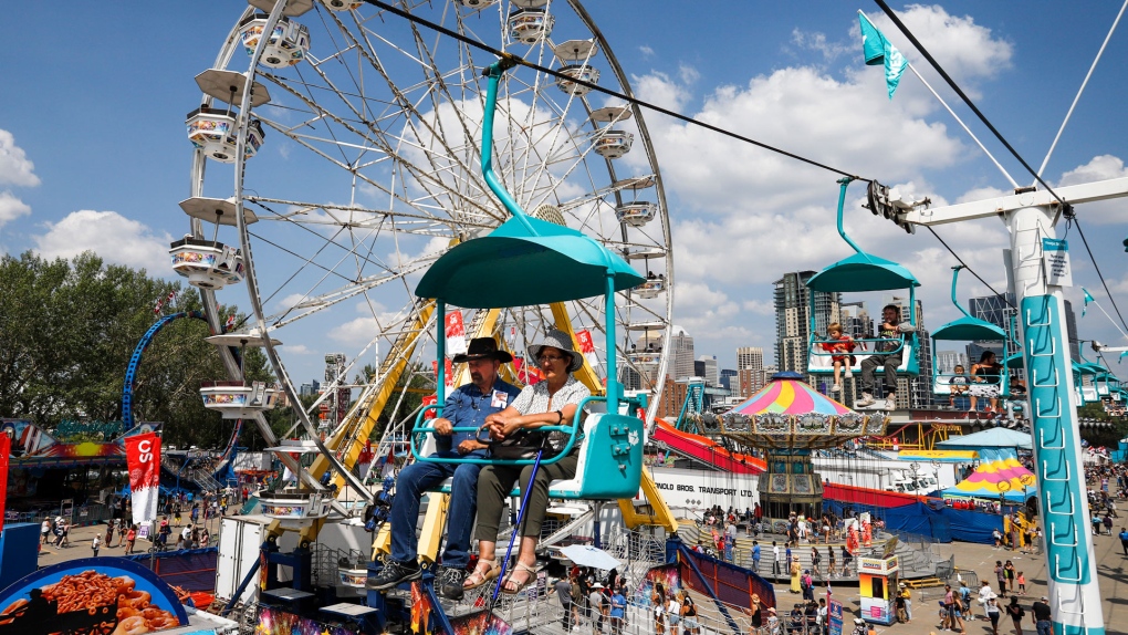 Visitors take the skyride for a high angle view during the Calgary Stampede in Calgary, Friday, July 9, 2021. THE CANADIAN PRESS/Jeff McIntosh 
