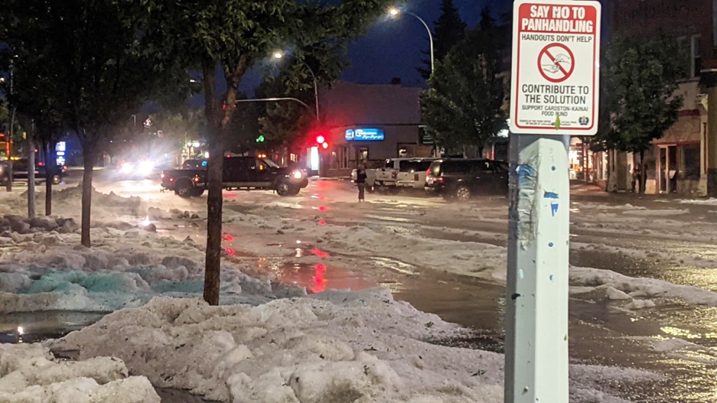 Hail was piled close to a metre high in some places, looking more like a snow storm had swept through the community after a big storm Monday night. Lower parts of downtown Cardston were flooded as the hail began melting.