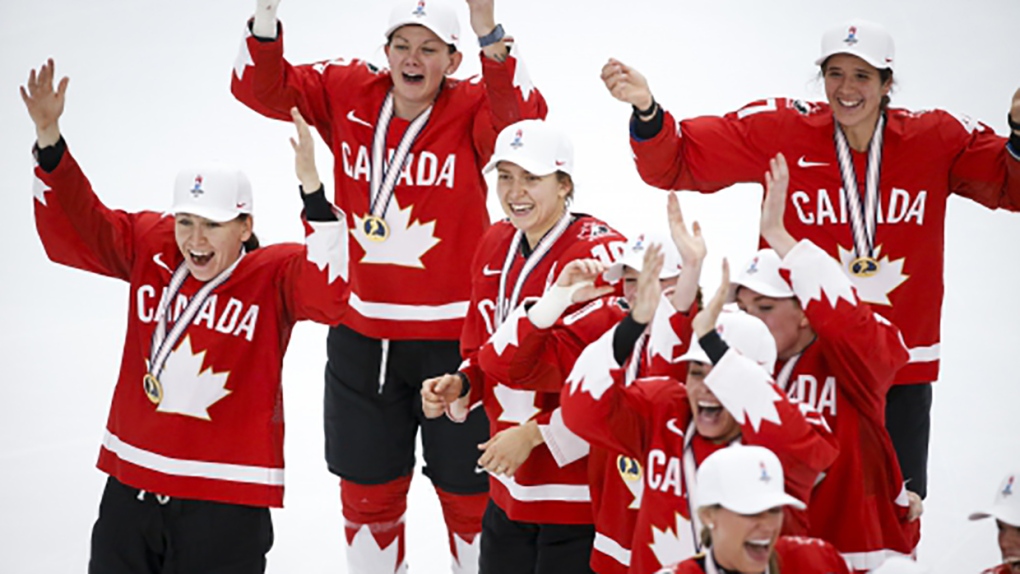 Team Canada celebrates defeating the United States to win gold at the IIHF Women's World Championship in Calgary, Tuesday, Aug. 31, 2021.THE CANADIAN PRESS/Jeff McIntosh