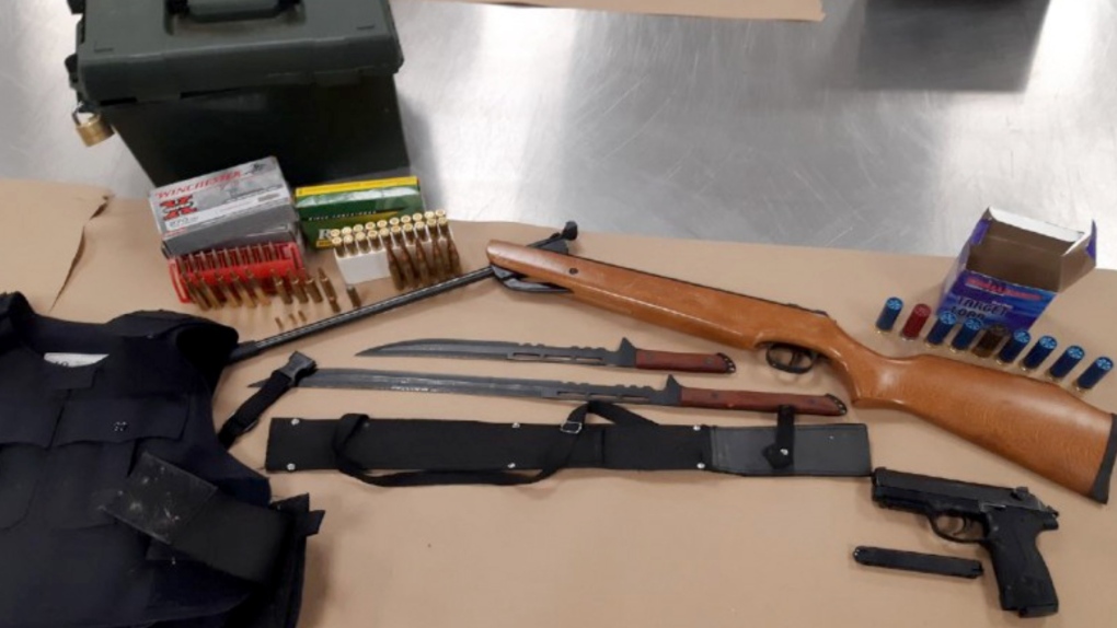 Some of the guns and ammunition seized by police from a Beltline apartment. (Calgary police handout)