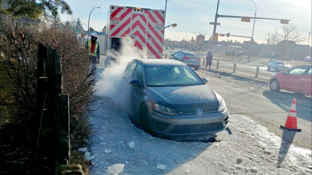 Calgary city crews freed a car frozen in place after a water main break. 