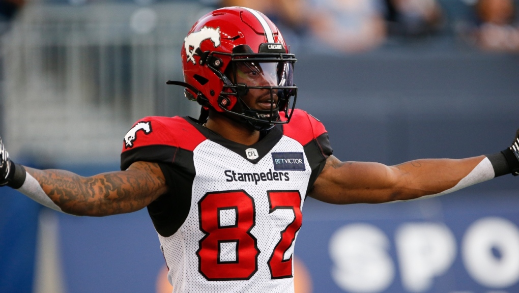 Calgary Stampeders' Malik Henry (82) celebrates his touchdown against the Winnipeg Blue Bombers during the first half CFL action in Winnipeg Thursday, August 25, 2022. Henry revealed on social media Sunday that he has a ruptured Achilles tendon. (THE CANADIAN PRESS/John Woods)