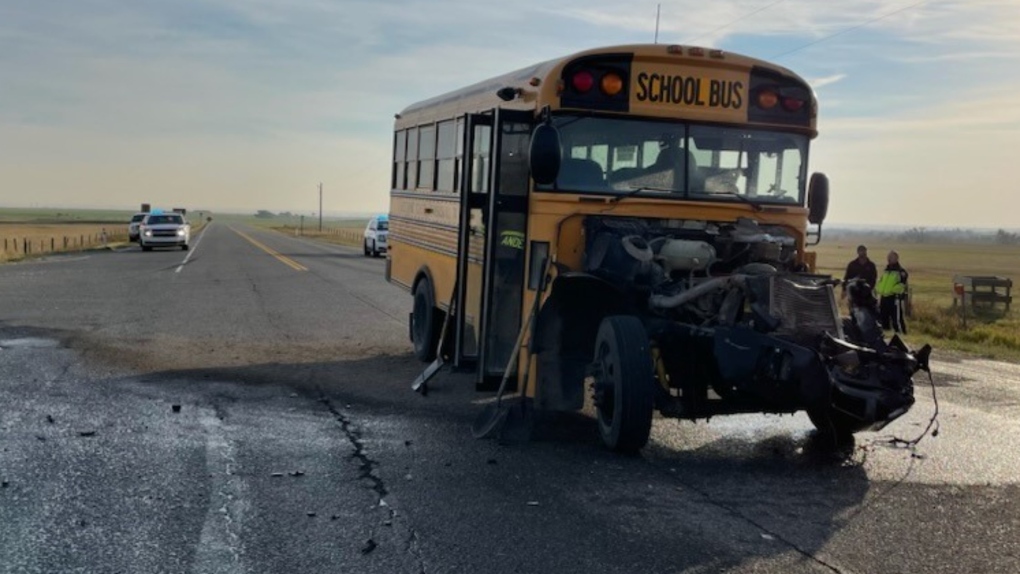 Damage to the front end of a school bus following an Oct. 5 collision with a semi-truck at the intersection of Highways 810 and 505 in southern Alberta. (RCMP)