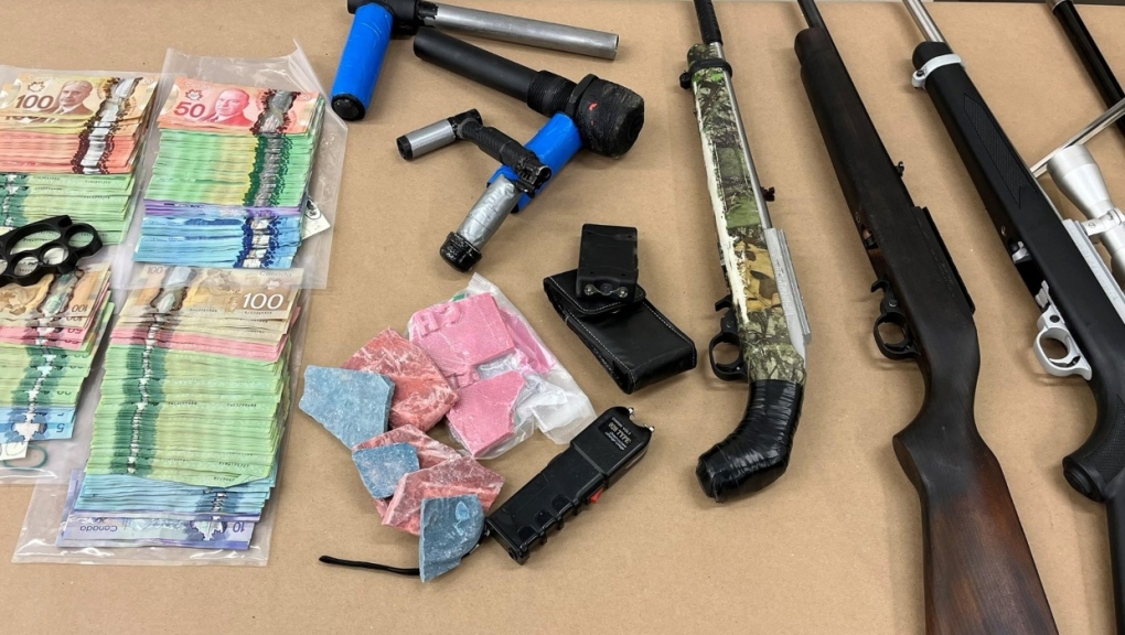 The Lethbridge Police Service displays some of the items seized during the search of a home on Wednesday, Nov. 23, 2022. (Lethbridge Police Service handout) 