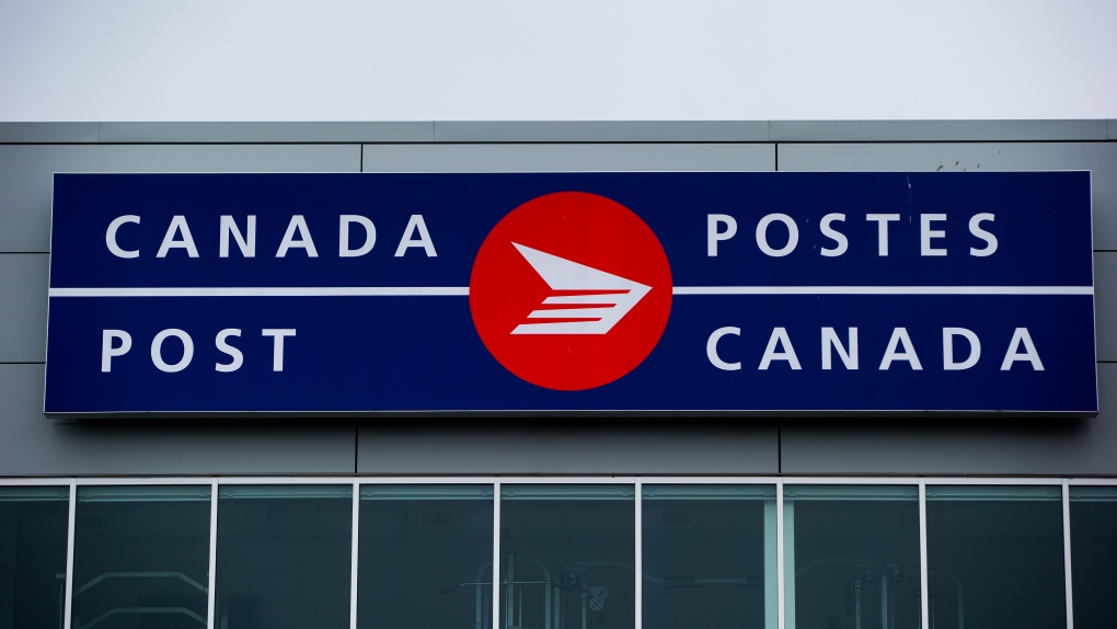The Canada Post logo is seen on the outside the company's Pacific Processing Centre, in Richmond, B.C., on June 1, 2017. RCMP say two Calgarians broke into three post offices in rural Alberta communities between in October and November. THE CANADIAN PRESS/Darryl Dyck