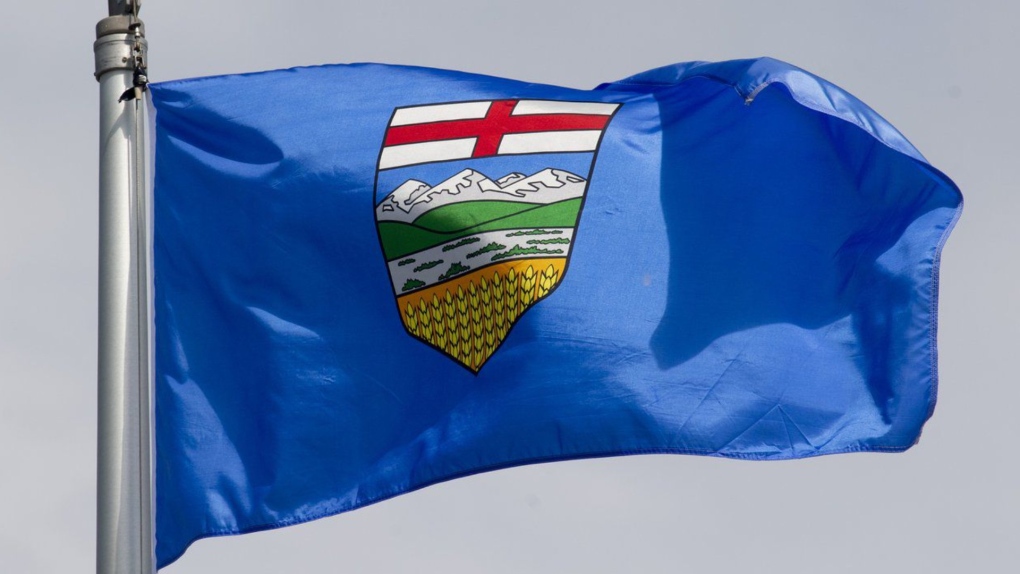Alberta's provincial flag flies in Ottawa on June 30, 2020. New Alberta government research says windblown dust from mountaintop coal mines has polluted a pristine alpine lake to the point where its waters are as contaminated as lakes downwind from the oilsands. (THE CANADIAN PRESS/Adrian Wyld)