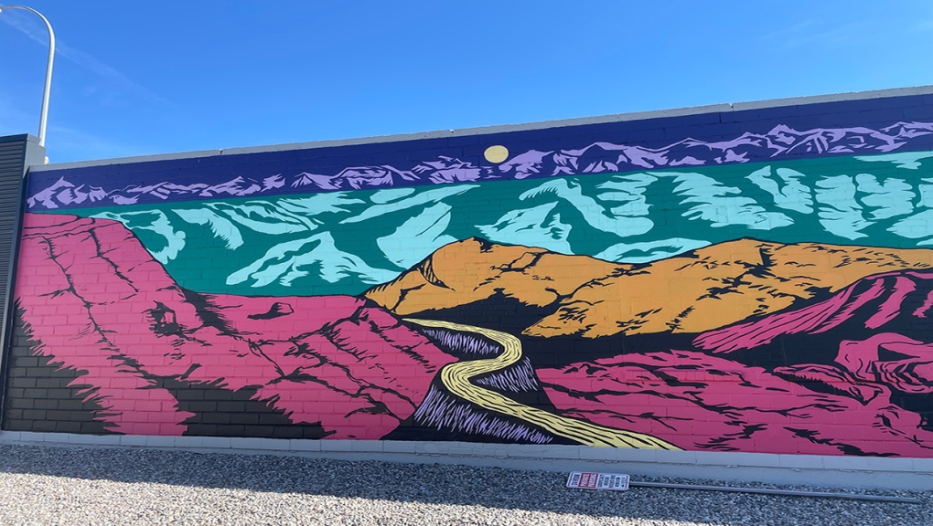 Unreality is a mural by Kylie Fineday, that's on display on the west side of the Backyard Leisure building in Lethbridge