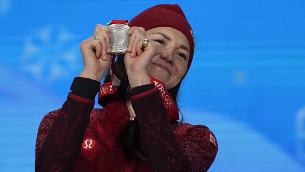 Silver medallist Isabelle Weidemann of Canada celebrates during the medal ceremony for the women's 5,000-meters speedskating at the 2022 Winter Olympics, Friday, Feb. 11, 2022, in Beijing. (THE CANADIAN PRESS/AP, Jae C. Hong)