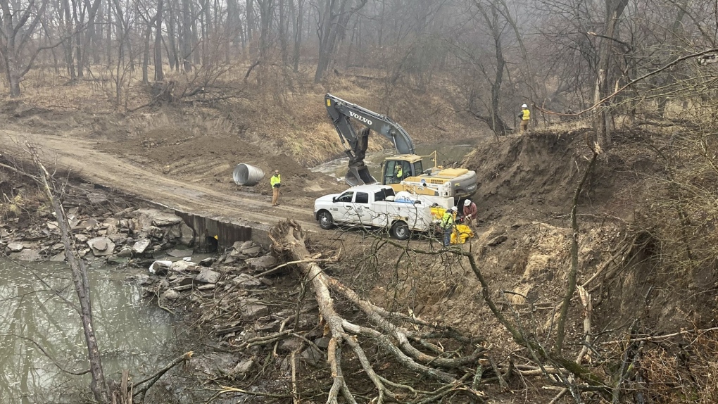 The Washington County Road Department constructs an emergency dam to intercept an oil spill after a Keystone pipeline ruptured at Mill Creek in Washington County, Kan., on Dec 8, 2022. (Kyle Bauer/KCLY/KFRM Radio via AP)