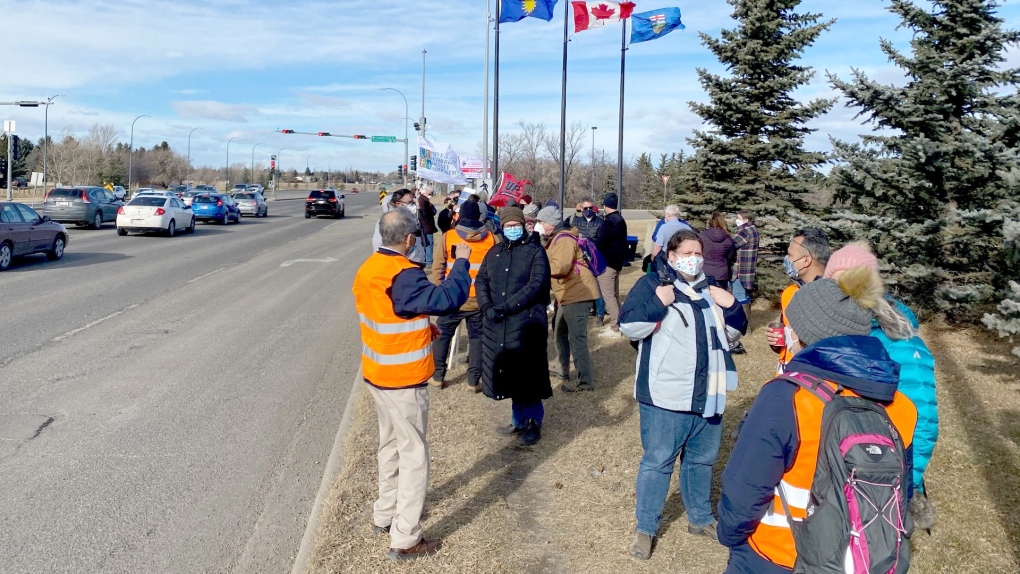 Members of the University  of Lethbridge Faculty Association picket outside the school on Thursday. 