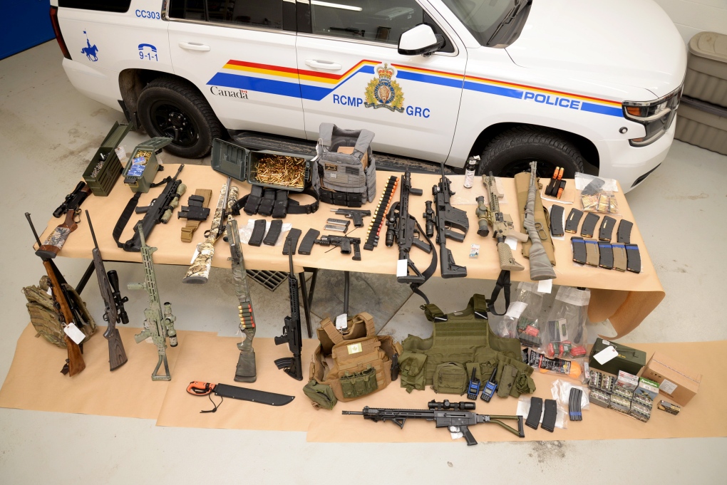 Some of the weapons seized by police from a blockade at the Canada-U.S. border crossing near Coutts, Alta.
