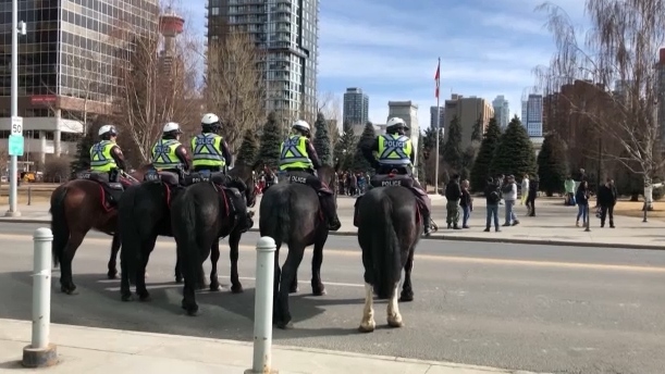 Calgary Police Service members monitor demonstrations against COVID-19 public health restrictions on March 19, 2022 (CTV News Calgary).