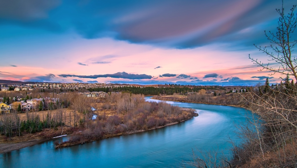 A vivid long exposure view of clouds over the Bow River from a park lookout in Cochrane. (Getty Images) 