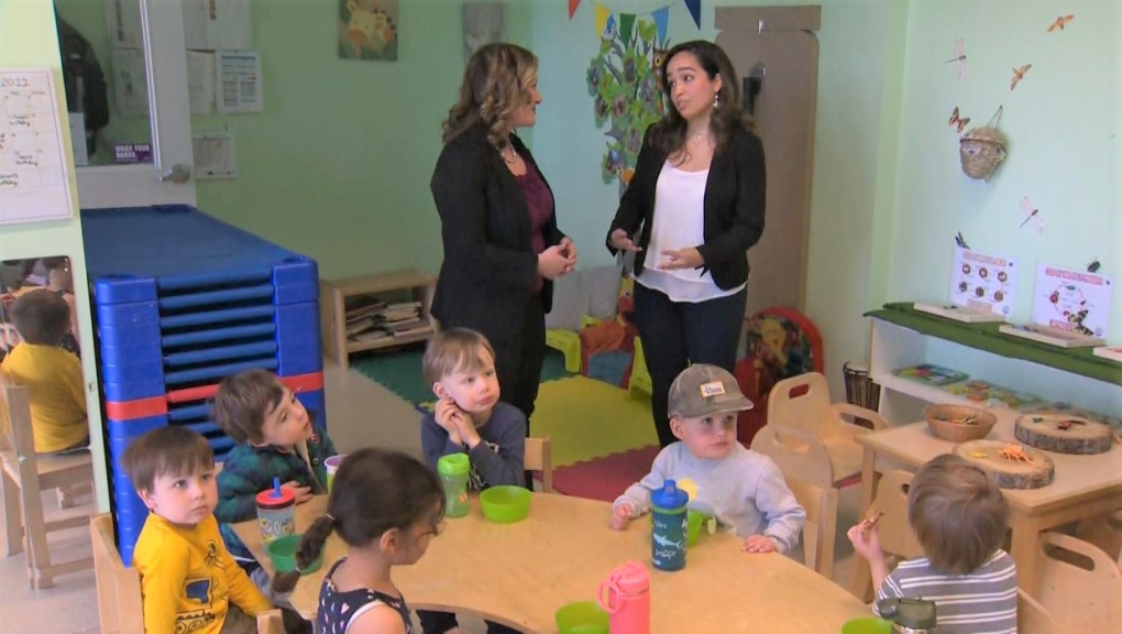 Jessica Molina, assistant supervisor at Calgary's Little Worlds Learning Center (right) speaks with Rebecca Schulz, Alberta's minister of children’s services (left). 