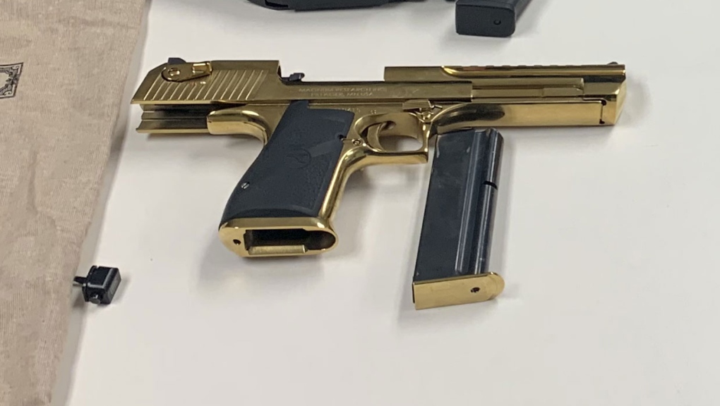 Police in Strathmore, Alta. recovered this gold-coloured handgun, which they say was stolen from a gun store in Dunmore earlier this month. (Supplied