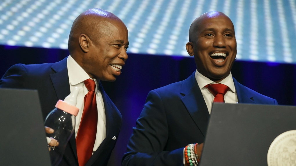 In this photo provided by The Inner Circle Show, New York Mayor Eric Adams, left, performs with "Saturday Night Live's" Chris Redd during the mayor's response to "Adams' Apple," the 98th annual Inner Circle Show, in New York, Saturday, April 30, 2022.. (Todd Maisel/The Inner Circle Show via AP) 
