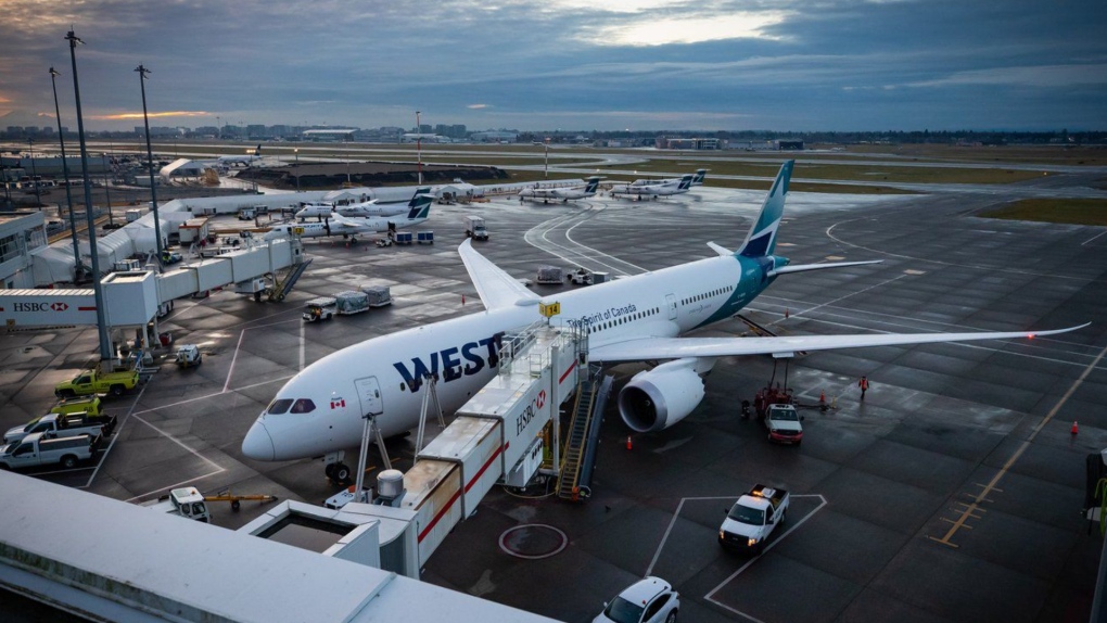 A WestJet Airlines Boeing 787-9 Dreamliner is seen parked at a gate at Vancouver International Airport, in Richmond, B.C., on Jan. 21, 2021. The WestJet Group has announced a new strategy that will see the Calgary-based airline refocus its routes and fleet on serving Western Canada. (THE CANADIAN PRESS/Darryl Dyck)