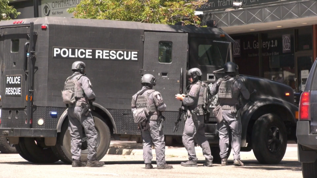 Tactical team members outside of the Lethbridge Legal Guidance office in downtown Lethbridge on July 14 during a hostage situation.