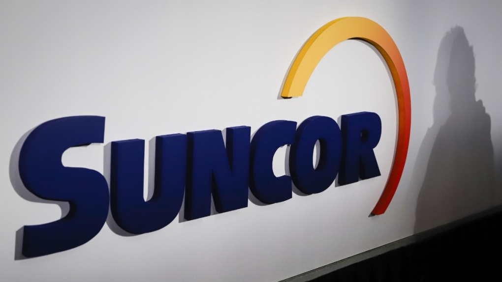 A Suncor logo is shown at the company's annual meeting in Calgary, on May 2, 2019. (Jeff McIntosh / THE CANADIAN PRESS)