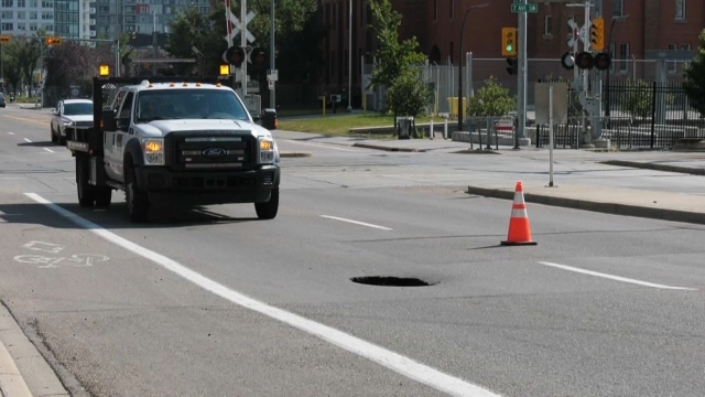 A large hole appeared in Calgary this afternoon on 11 Street S.W. (CTV News Calgary)