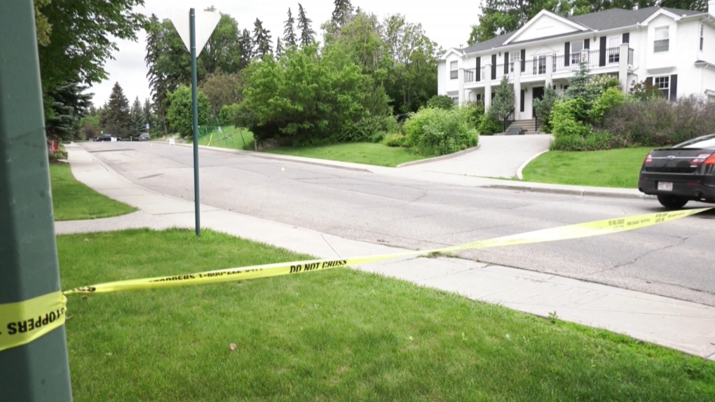 Crime scene tape in Calgary's Upper Mount Royal neighbourhood after the body of 34-year-old Shawn McCormack was found in an alleyway on July 3.
