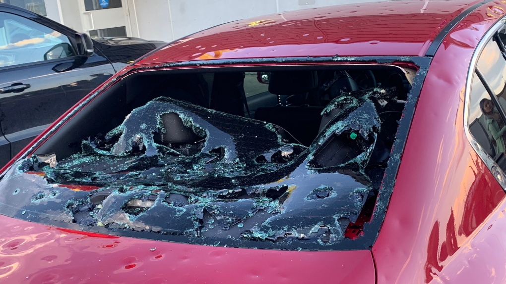 A car has major damage after getting stranded by a storm producing massive hail (Source: Jay Lesyk).
