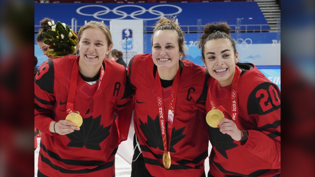 Team Canada's Brianne Jenner (19), Marie-Philip Poulin (29) and Sarah Nurse (20) celebrate with their gold medals after defeating the United States in women's hockey gold medal game action at the 2022 Winter Olympics in Beijing on Feb. 17, 2022.  (THE CANADIAN PRESS/Ryan Remiorz)
