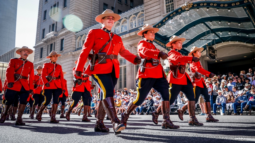 RCMP members march during the Calgary Stampede parade in Calgary, Friday, July 8, 2022. THE CANADIAN PRESS/Jeff McIntosh