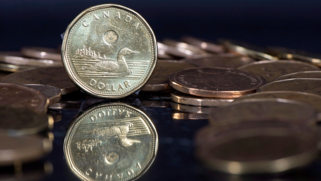 The Canadian dollar coin, the Loonie, is displayed Friday, January 30, 2015 in Montreal. (THE CANADIAN PRESS/Paul Chiasson)
