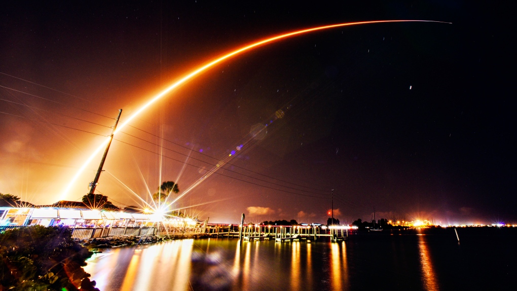 A SpaceX Falcon 9 rocket lifts off from the Cape Canaveral Space Force Station, Friday, Nov. 3, 2023, and viewed over the Banana River from Merritt Island, Fla.. The rocket is carrying 23 Starlink satellites and is the 60th orbital launch of 2023 from Brevard County. (Malcolm Denemark/Florida Today via AP)