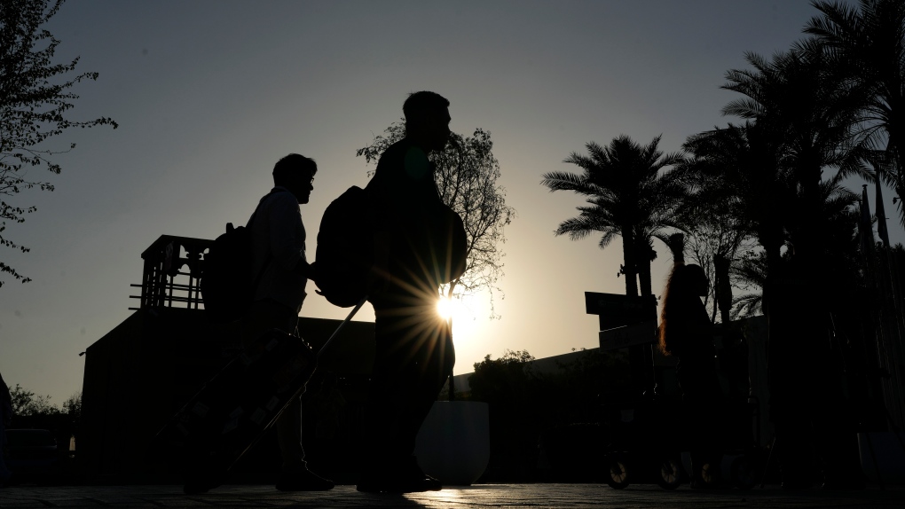 People walk through the venue ahead of the COP28 U.N. Climate Summit, Wednesday, Nov. 29, 2023, in Dubai, United Arab Emirates. (AP Photo/Rafiq Maqbool)