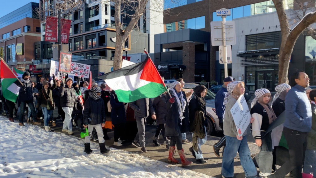 Pro-Palestinian Protestors lined up along 17 Avenue S.W. in Calgary on Sunday. (Tyson Fedor/CTV News Calgary)