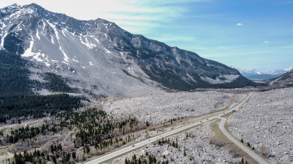 Traffic travels along Highway 3 through the remains of the Frank Slide in the Crowsnest Pass near Blairmore, Alta., Wednesday, May 3, 2023. On April 29, 1903 a massive landslide buried the town of Frank killing 70 people. THE CANADIAN PRESS/Jeff McIntosh