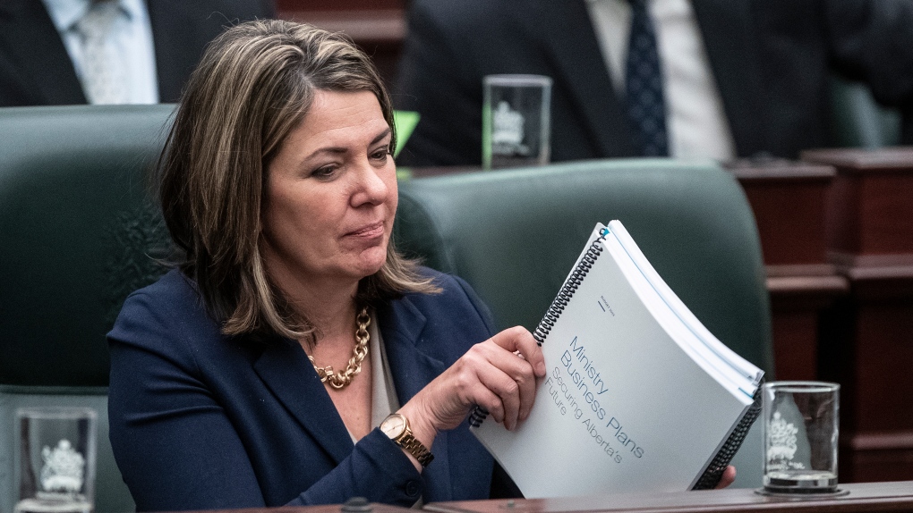 Alberta Premier Danielle Smith listens as Alberta Finance Minister Travis Toews delivers the 2023 budget, in Edmonton on Tuesday, February 28, 2023. THE CANADIAN PRESS/Jason Franson