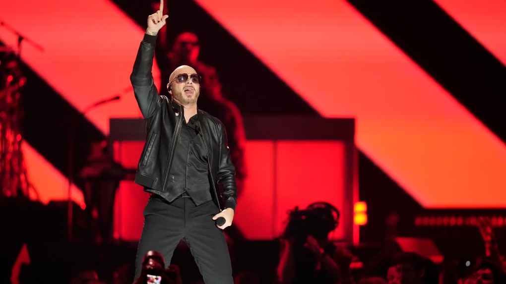 Pitbull performs on the first night of the 2022 iHeartRadio Music Festival, Friday, Sept. 23, 2022, in Las Vegas. (AP Photo/John Locher)