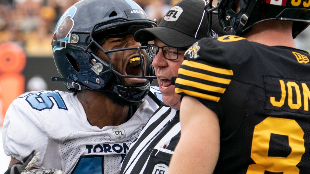 Toronto Argonauts linebacker Justin Herdman-Reed (45) yells toward Hamilton Tiger-Cats wide receiver Brian Jones (89) during first half CFL football game action in Hamilton, Ont., on Monday, Sept. 2, 2019. THE CANADIAN PRESS/Peter Power