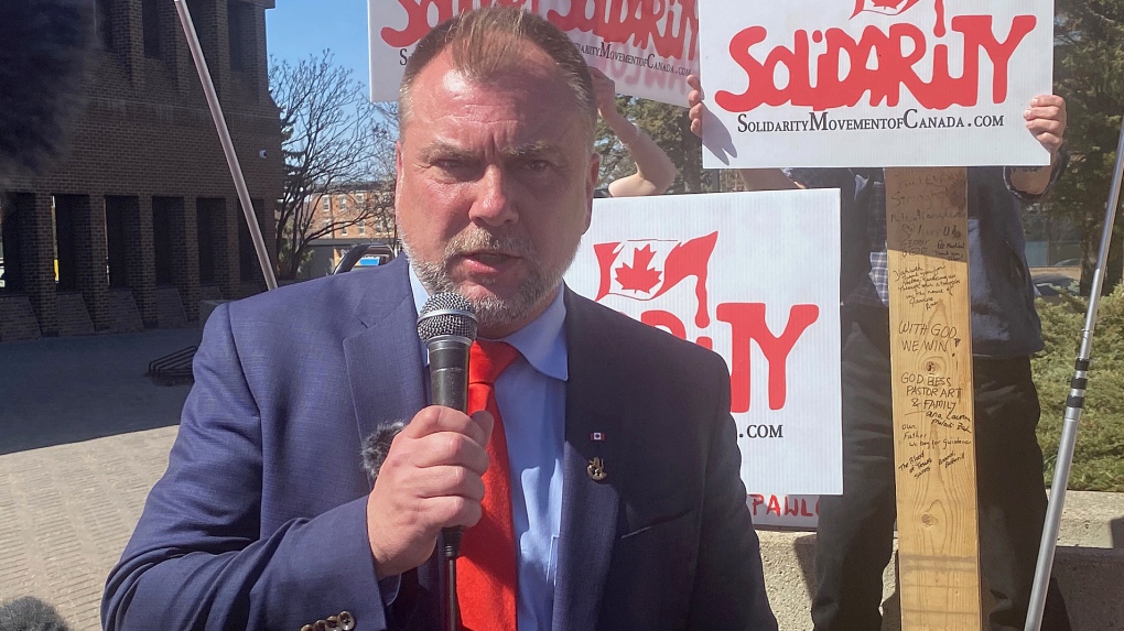 Artur Pawlowski speaks to supporters outside the courthouse in Lethbridge, Alta., Tuesday, May 2, 2023. A judge has found Pawlowski, a Calgary pastor, guilty of mischief for his role in protests against COVID-19 public health measures. THE CANADIAN PRESS/Bill Graveland