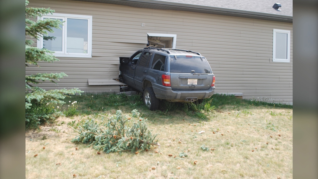 A man has been charged after driving his Jeep Cherokee into the wall of an attached garage in rural Alberta
